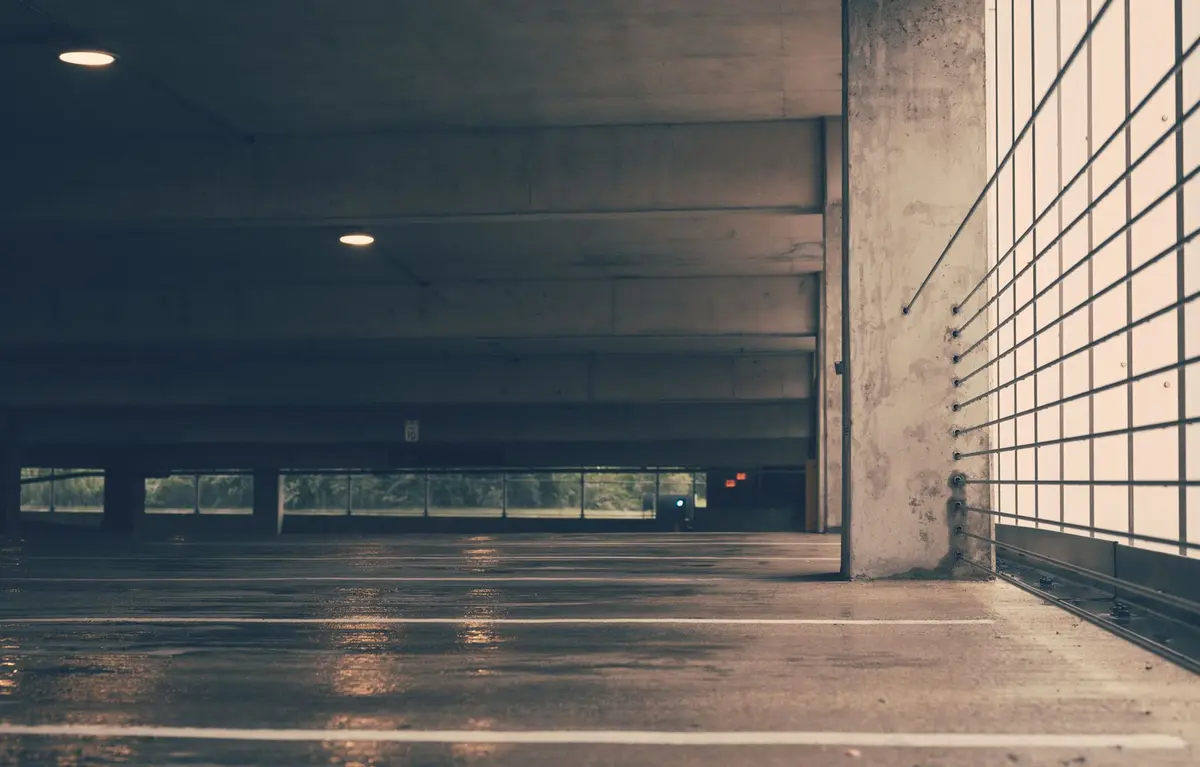 Bare grey concrete floor of an empty garage